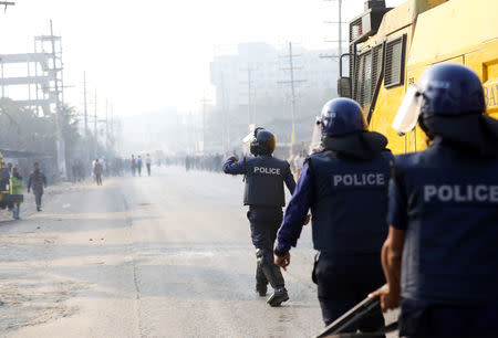 Police chase garments workers who have been protesting for higher wages, with water cannon at Ashulia, outskirt of Dhaka, Bangladesh, January 14, 2019. REUTERS/Mohammad Ponir Hossain