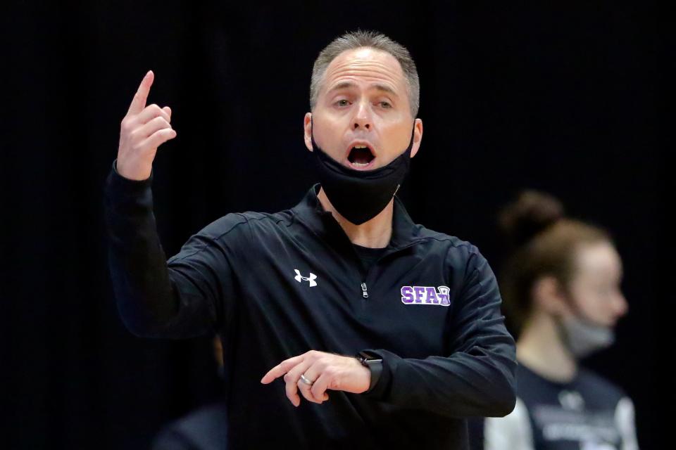 Mark Kellogg, then coach at Stephen F. Austin, gestures to his team during a Southland Conference tournament game against Sam Houston on March 14, 2021, in Katy.