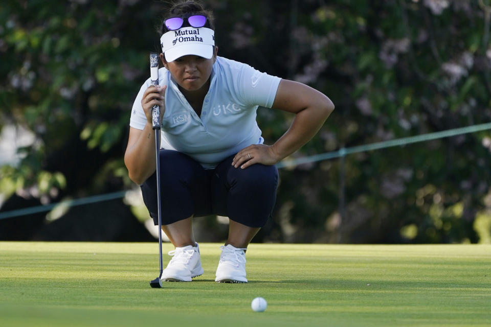 Megan Khang lines up a putt on the 7th green during the first round of the LPGA Cognizant Founders Cup golf tournament, Thursday, May 12, 2022, in Clifton, N.J. (AP Photo/Seth Wenig)