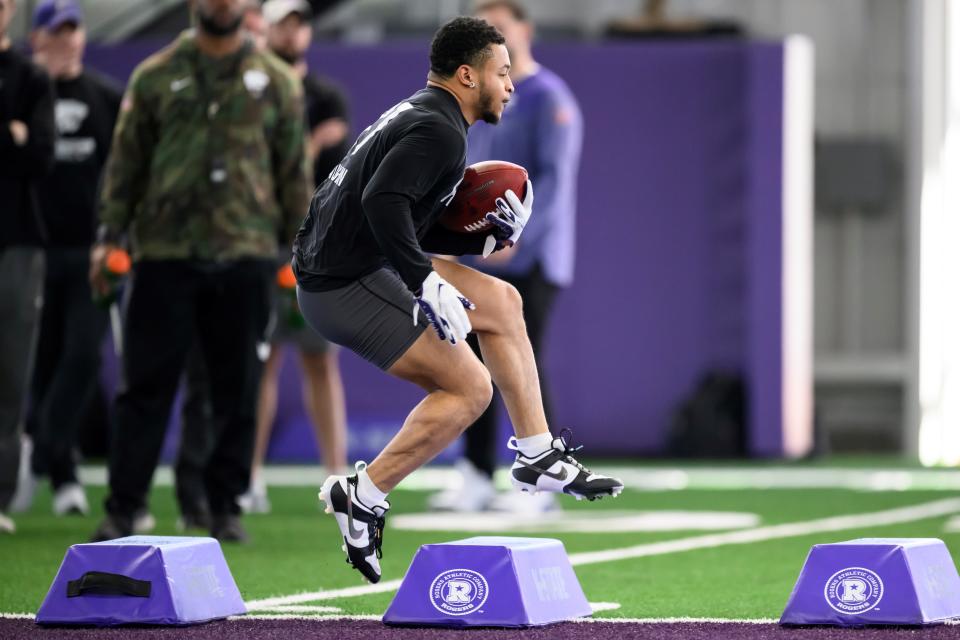 Kansas State running back Deuce Vaughn goes through a drill during the Wildcats' NFL pro day on Friday in Manhattan.