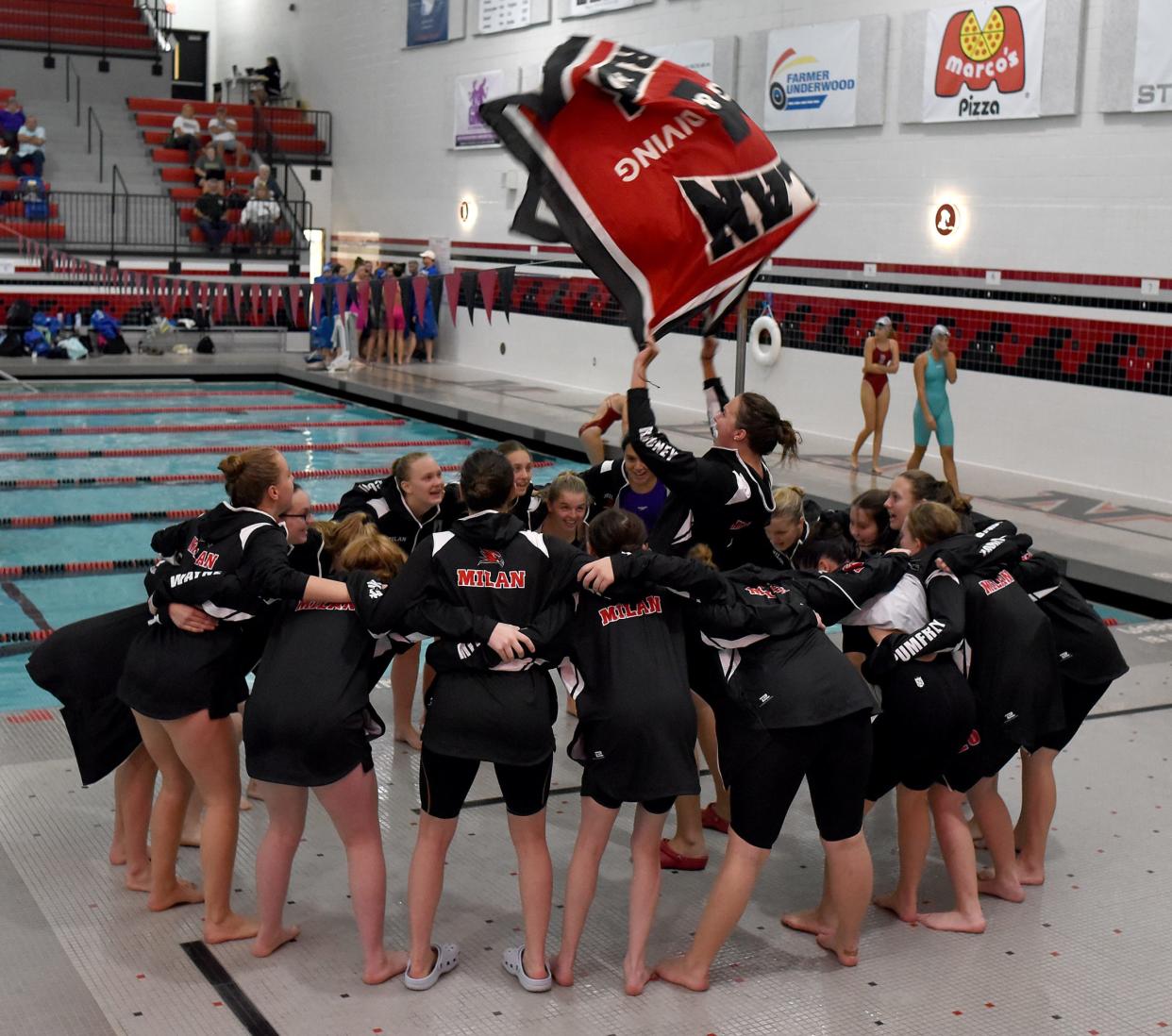 Phoebe Rhoney leads Milan in a cheer before the start of swimming in the Monroe County Swim Finals Saturday.