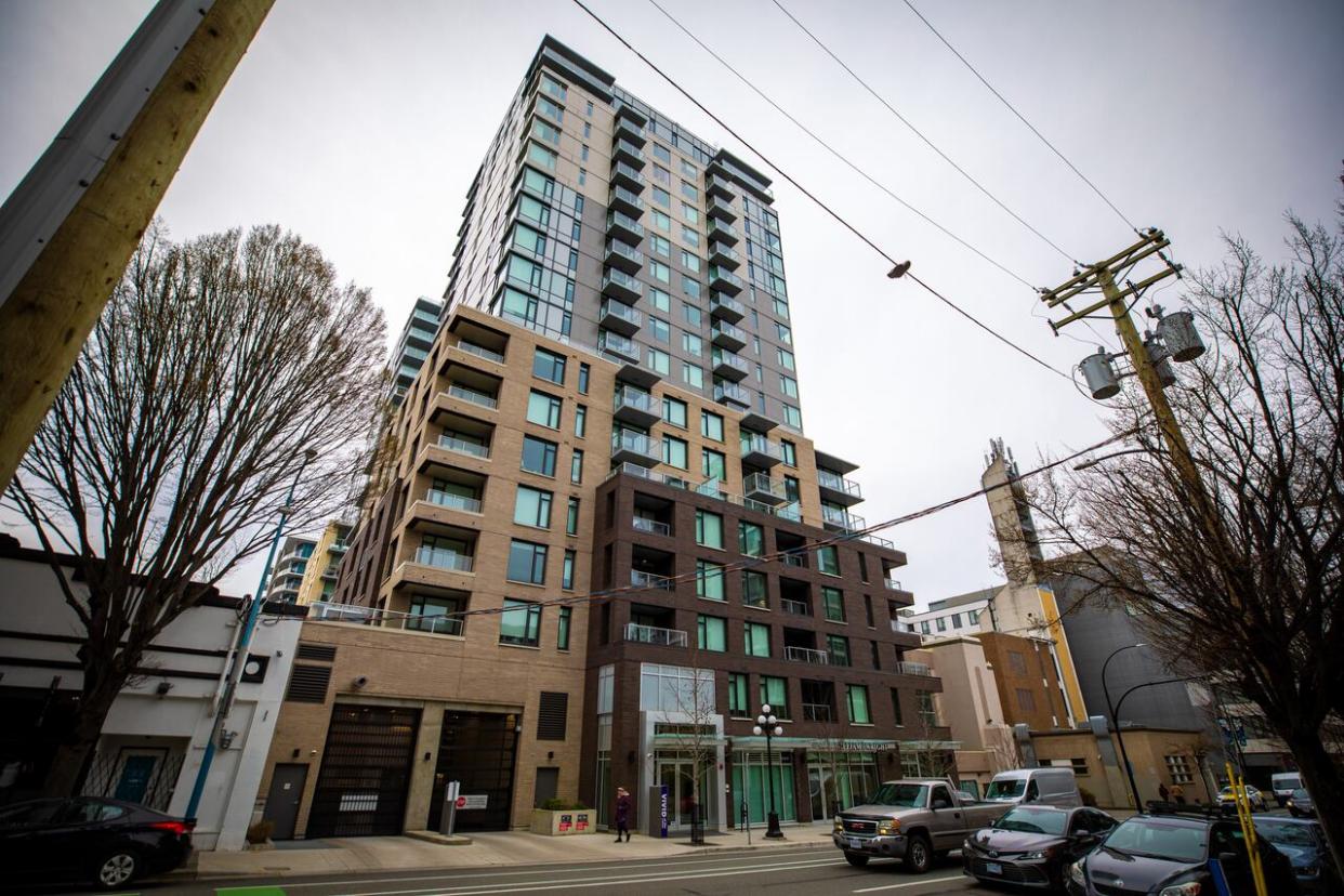 Victoria's Vivid condominium building was a pilot project for a program intended to help middle-income families enter B.C.'s housing market. But lawsuits filed by B.C. Housing claim at least a dozen people who already owned multiple properties bought units (Mike McArthur/CBC - image credit)