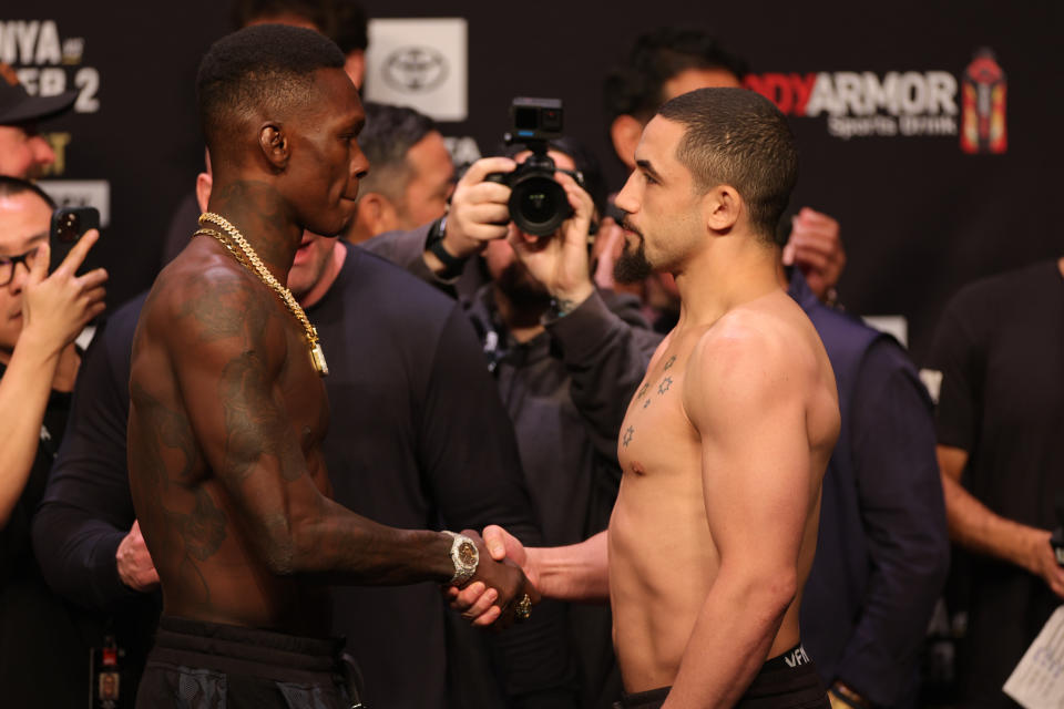 HOUSTON, TEXAS – FEBRUARY 11: Israel Adesanya of Nigeria takes on Robert Whittaker of Australia in the weigh-in ceremony ahead of UFC 271 at Toyota Center on February 11, 2022 in Houston, Texas.  (Photo by Carmen Mandato/Getty Images)