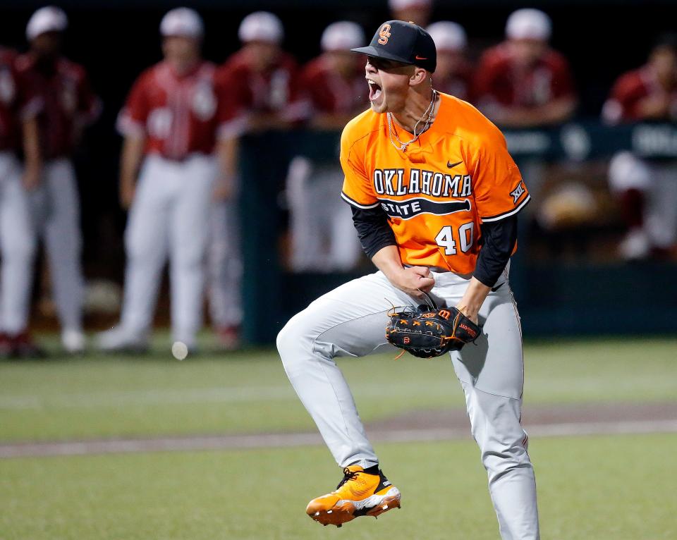 OSU's Kale Davis (40) celebrates the last out of an 8-7 win against OU on May 2 at L. Dale Mitchell Park in Norman.