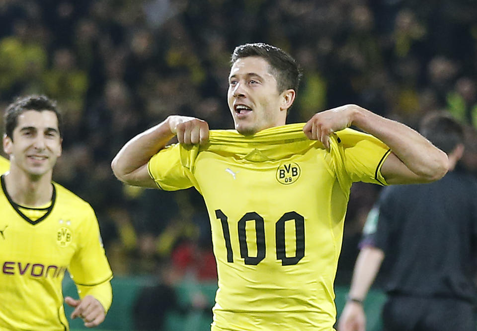 Dortmund's Robert Lewandowski of Poland, right, celebrates with Dortmund's Henrikh Mkhitaryan of Armenia, left, after scoring during the German soccer cup (DFB Pokal) semifinal match between BvB Borussia Dortmund and VfL Wolfsburg Tuesday, April 15, 2014 in Dortmund, Germany. (AP Photo/Frank Augstein)