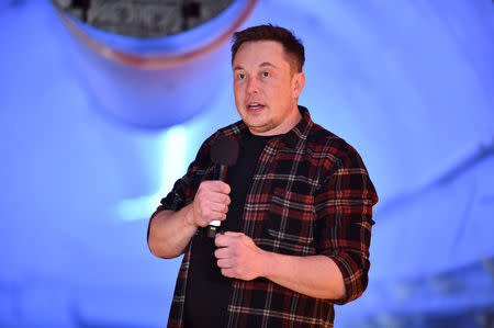 FILE PHOTO: Tesla Inc. founder Elon Musk speaks at the unveiling event by "The Boring Company" for the test tunnel of a proposed underground transportation network across Los Angeles County, in Hawthorne, California, U.S. December 18, 2018. Robyn Beck/Pool via REUTERS