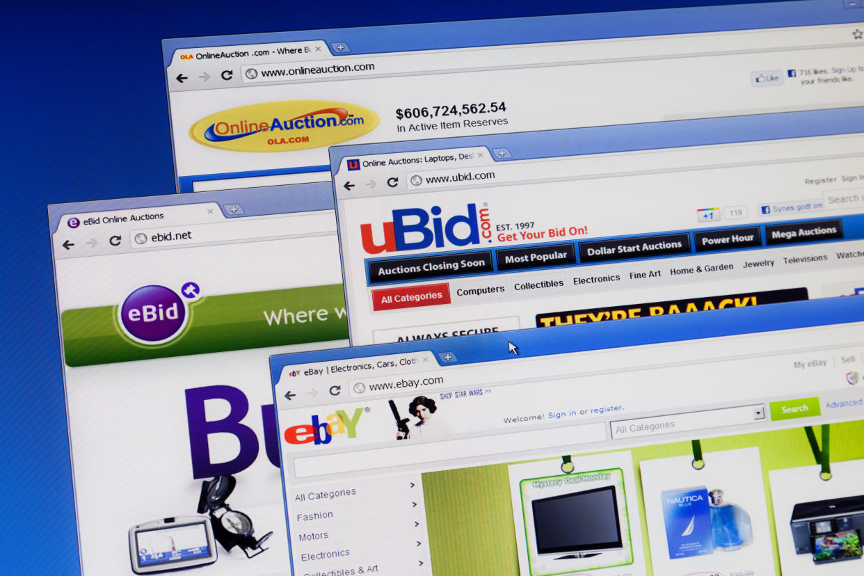 Warsaw, Poland - September 13, 2011: Photo of computer monitor with four browsers open. Ubid, eBid, Ebay and Online Auctions. The online auction business model is one in which participants bid for products and services over the Internet. The functionality of buying and selling in an auction format is made possible through auction software which regulates the various processes involved.