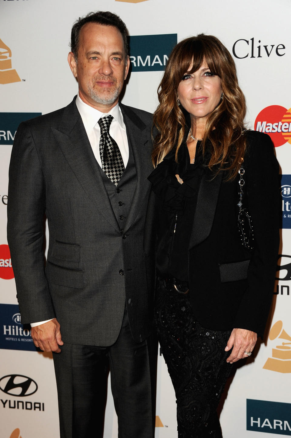 BEVERLY HILLS, CA - FEBRUARY 11: Actors Tom Hanks and Rita Wilson arrive at Clive Davis and the Recording Academy's 2012 Pre-GRAMMY Gala and Salute to Industry Icons Honoring Richard Branson held at The Beverly Hilton Hotel on February 11, 2012 in Beverly Hills, California. (Photo by Kevin Winter/Getty Images)