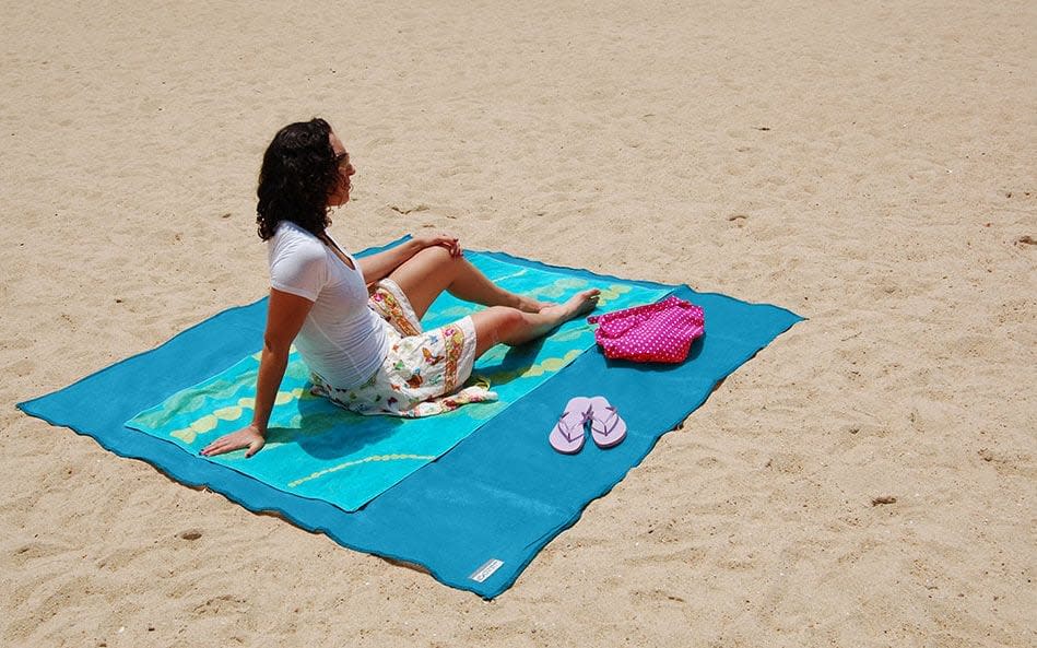 women on beach with CGear sand free mat - Credit: CGear