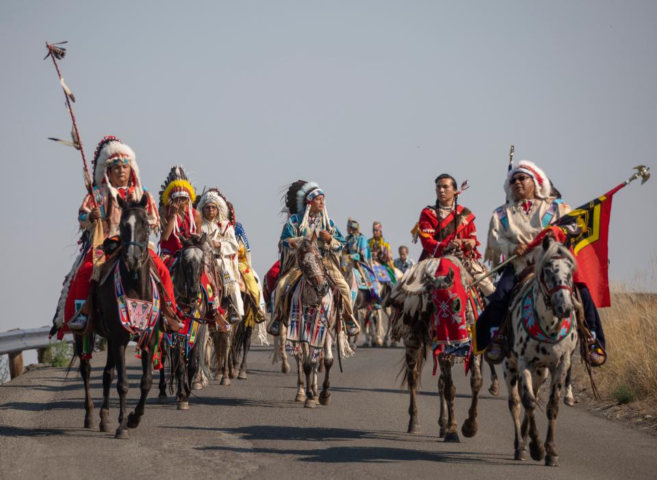 Members of the Nez Perce tribe ride to Am’sáaxpa or "the place of boulders," for a land blessing ceremony on Thursday, July 29, 2021 in Joseph, Ore. The tribe purchased 148 acres of ancestral land in December 2020, over a century after being forced out of the area.