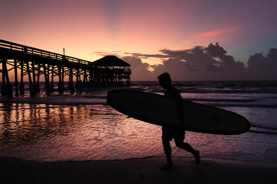 Surfer Scott Norwood prepares to go in the water as Hurricane Dorian approaches Florida, on August 31, 2019 in Cocoa Beach, Florida.   (Photo: Mark Wilson/Getty Images)