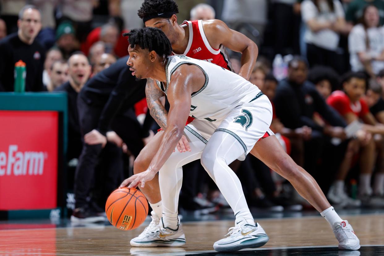 Michigan State guard A.J. Hoggard, left, is pressured by Ohio State guard Roddy Gayle Jr. during the first half at Breslin Center in East Lansing on Sunday, Feb. 25, 2024.
