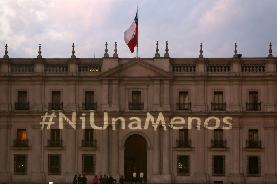 The #NiUnaMenos hashtag is shown on the presidential palace 'La Moneda' during protests in Santiago, Chile on October 19.