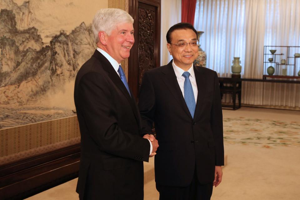Michigan Gov. Rick Snyder shakes hands with Chinese Premier Li Keqiang ahead of a meeting at the Zhongnanhai Leadership Compound on Aug. 1, 2017, in Beijing.