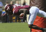 Virginia Tech wide receiver Tre Turner (11) scores on a 11 yard touchdown play in the first half of the Richmond Virginia Tech NCAA college football game in Blacksburg, Va., Saturday, Sept. 25 2021. (Matt Gentry/The Roanoke Times via AP)