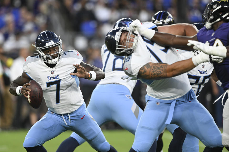 Tennessee Titans quarterback Malik Willis (7) scrambles as offensive tackle Dillon Radunz (75) blocks for him during the first half of an NFL football game against the Baltimore Ravens, Thursday, Aug. 11, 2022, in Baltimore. (AP Photo/Gail Burton)