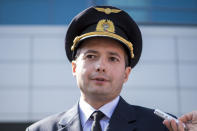 Damir Yusupov, 41-year-old Russian pilot, speaks to the media in Yekaterinburg, Russia, Friday, Aug. 16, 2019. A Russian pilot who managed to smoothly land his disabled plane in a corn field after birds hit both engines said Friday that a quick landing was his only chance and he was not afraid of handling it. (AP Photo)