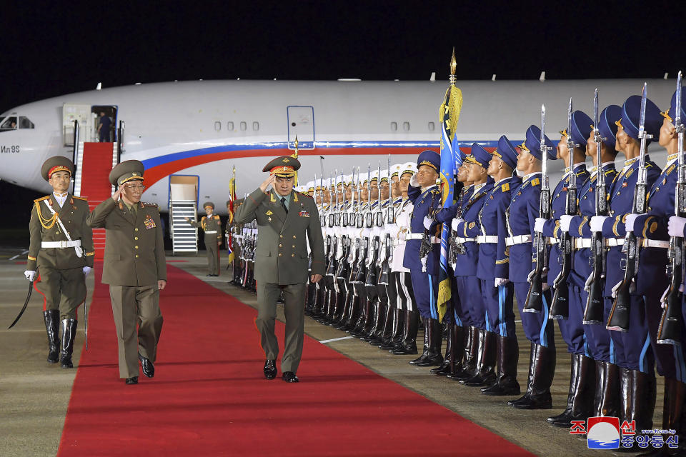 In this photo provided by the North Korean government, Russian Defense Minister Sergei Shoigu, center, and North Korean Defense Minister Kang Sun Nam, second left, review the honor guard at the Pyongyang International Airport in Pyongyang, North Korea Tuesday, July 25, 2023. Independent journalists were not given access to cover the event depicted in this image distributed by the North Korean government. The content of this image is as provided and cannot be independently verified. Korean language watermark on image as provided by source reads: "KCNA" which is the abbreviation for Korean Central News Agency. (Korean Central News Agency/Korea News Service via AP)