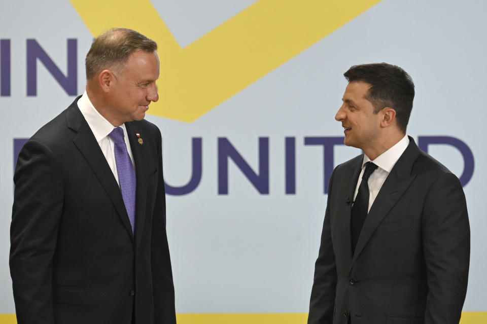 Ukrainian President Volodymyr Zelenskyy, right, and Polish President Andrzej Duda talk during the Crimean Platform Summit in Kyiv, Ukraine, Monday, Aug. 23, 2021. The Crimea Platform is a new international consultation and coordination format to strengthen an international response to the ongoing Russia's occupation of Crimea. (Ukrainian Presidential Press Office via AP)