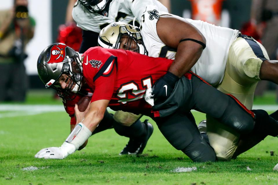 Saints defensive tackle David Onyemata sacks Tom Brady in the second half.