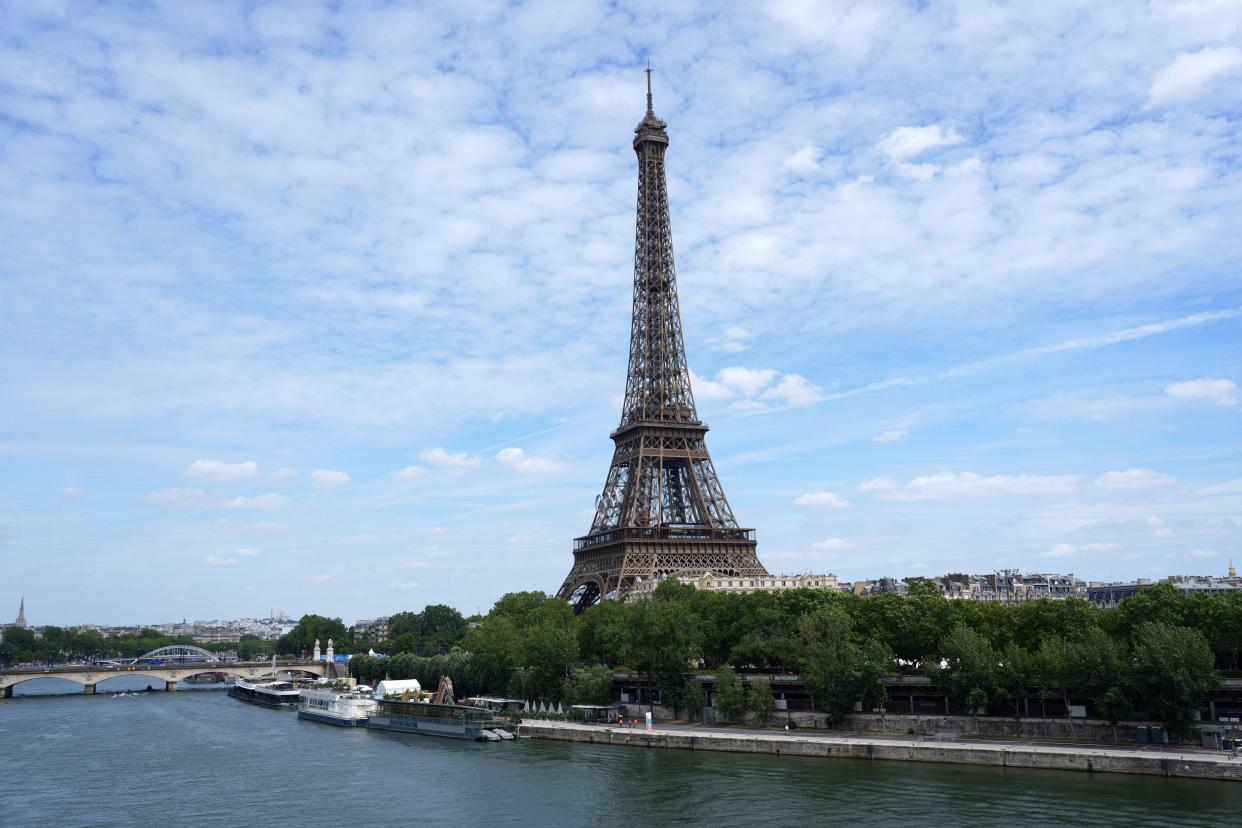 Skies were clear around the Eiffel Tower on Thursday, one day before the opening ceremony for the 2024 Summer Olympics, but that could change by the time the ceremony begins.