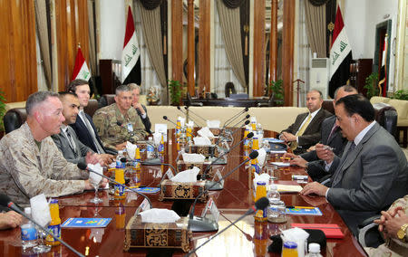 Iraq's Defence Minister Erfan al-Hiyali (R), meet with Marine Corps Gen. Joseph F. Dunford Jr., chairman of the Joint Chiefs of Staff (L), and U.S. President Donald Trump's son-in-law and senior advisor Jared Kushner in Baghdad, Iraq April 3, 2017. REUTERS/Stringer