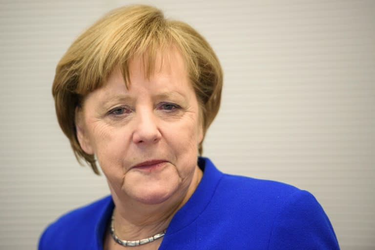 Observers say Merkel will lead a 'losers' coalition with little power to tackle major challenges