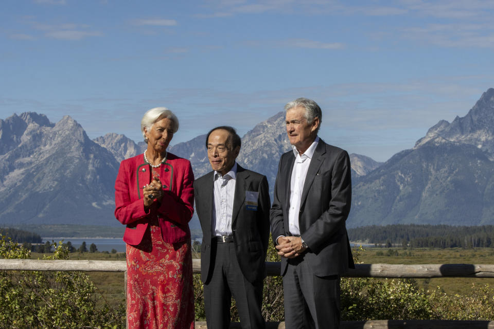 JACKSON HOLE, WYOMING - AUGUST 25: President of the European Central Bank Christine Lagarde (L), Bank of Japan Gov. Kazuo Ueda (C), and chair of the Federal Reserve Jerome Powell (R) speak in front of the Tetons during the Jackson Hole Economic Symposium at Jackson Lake Lodge on August 25, 2023 near Jackson Hole, Wyoming. Powell signaled in a speech Friday morning that if necessary, interest rates could be raised again. (Photo by Natalie Behring/Getty Images)