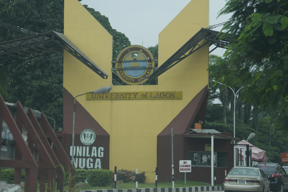 Cars drive past the University of Lagos in Nigeria, Wednesday Aug. 17, 2022. A strike declared by lecturers in Nigerian public universities has now clocked six months, hurting an estimated 2.5 million students who do not have other means of learning. Such strikes are common in this West African nation with more than 100 public universities. (AP Photo/Sunday Alamba)