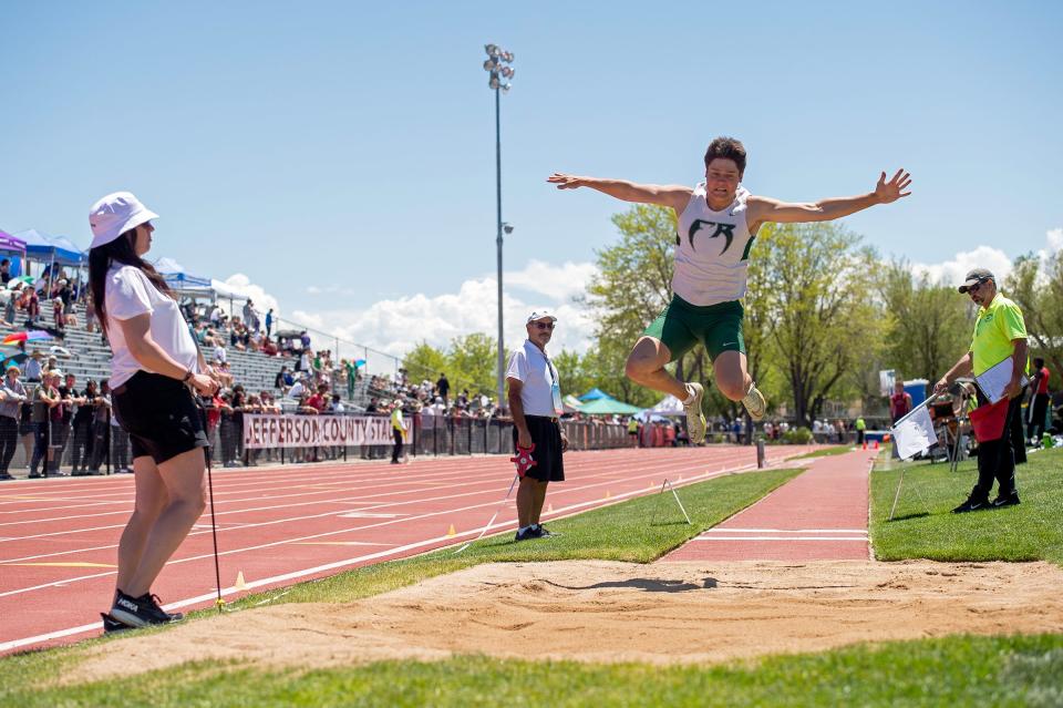 Fossil Ridge's Marcus Mozer leaps through the air in the 5A boys long jump finals during the Colorado track & field state championships on Thursday, May 16, 2024 at Jeffco Stadium in Lakewood, Colo. Mozer took 2nd by just a quarter-inch.