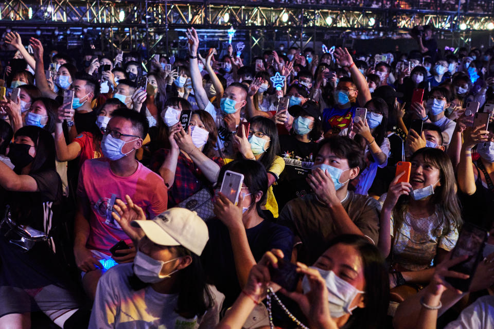 Attendees document Chou's performance on their smartphones<span class="copyright">An Rong Xu for TIME</span>