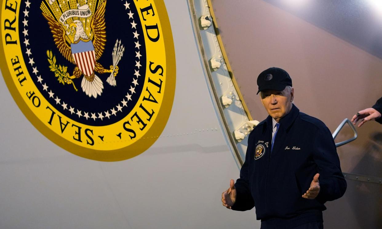 <span>Biden steps off Air Force One in Delaware on Wednesday night. The president is isolating at home with Covid.</span><span>Photograph: Susan Walsh/AP</span>