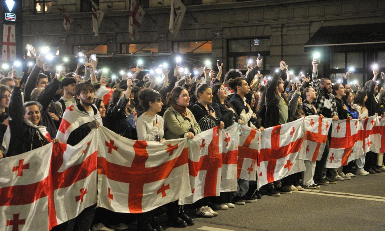 <span>Protesters in Tbilisi demonstrate against the law this week after it was voted through by the Georgian parliament.</span><span>Photograph: Nicolo Vincenzo Malvestuto/Getty Images</span>