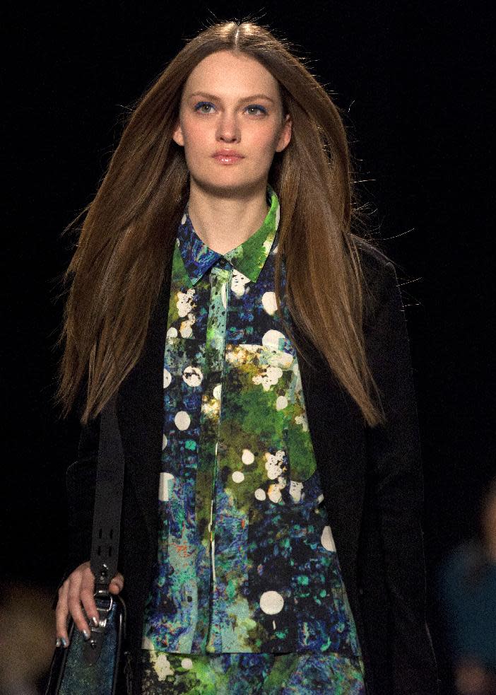 A model walks the runway during the Rebecca Minkoff Fall 2013 fashion show during Fashion Week, Friday, Feb. 8, 2013, in New York. (AP Photo/Karly Domb Sadof)