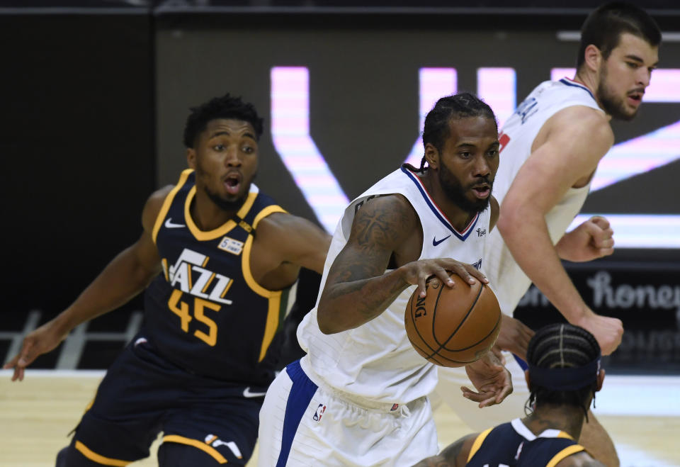 Can Clippers star Kawhi Leonard keep Jazz counterpart Donovan Mitchell on his heels? (Harry How/Getty Images)