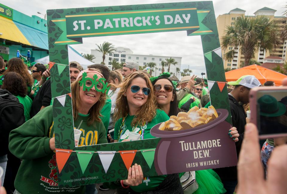 Revelers take in the spirit of St. Patrick’s Day Sunday, March 17, 2019 during the “Go Irish on the Island” Pub Crawl at Pensacola Beach.