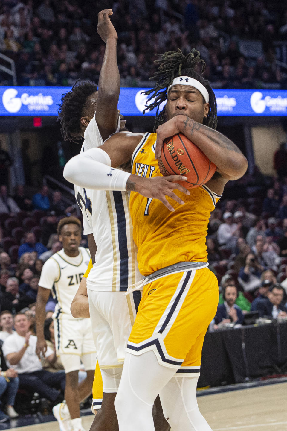 Kent State's VonCameron Davis (1) grabs a rebound as Akron's Ali Ali defends during the first half of an NCAA college basketball game in the championship of the Mid-American Conference tournament, Saturday, March 16, 2024, in Cleveland. (AP Photo/Phil Long)
