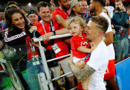 <p>England’s Kieran Trippier with a child after the match. REUTERS/Kai Pfaffenbach </p>
