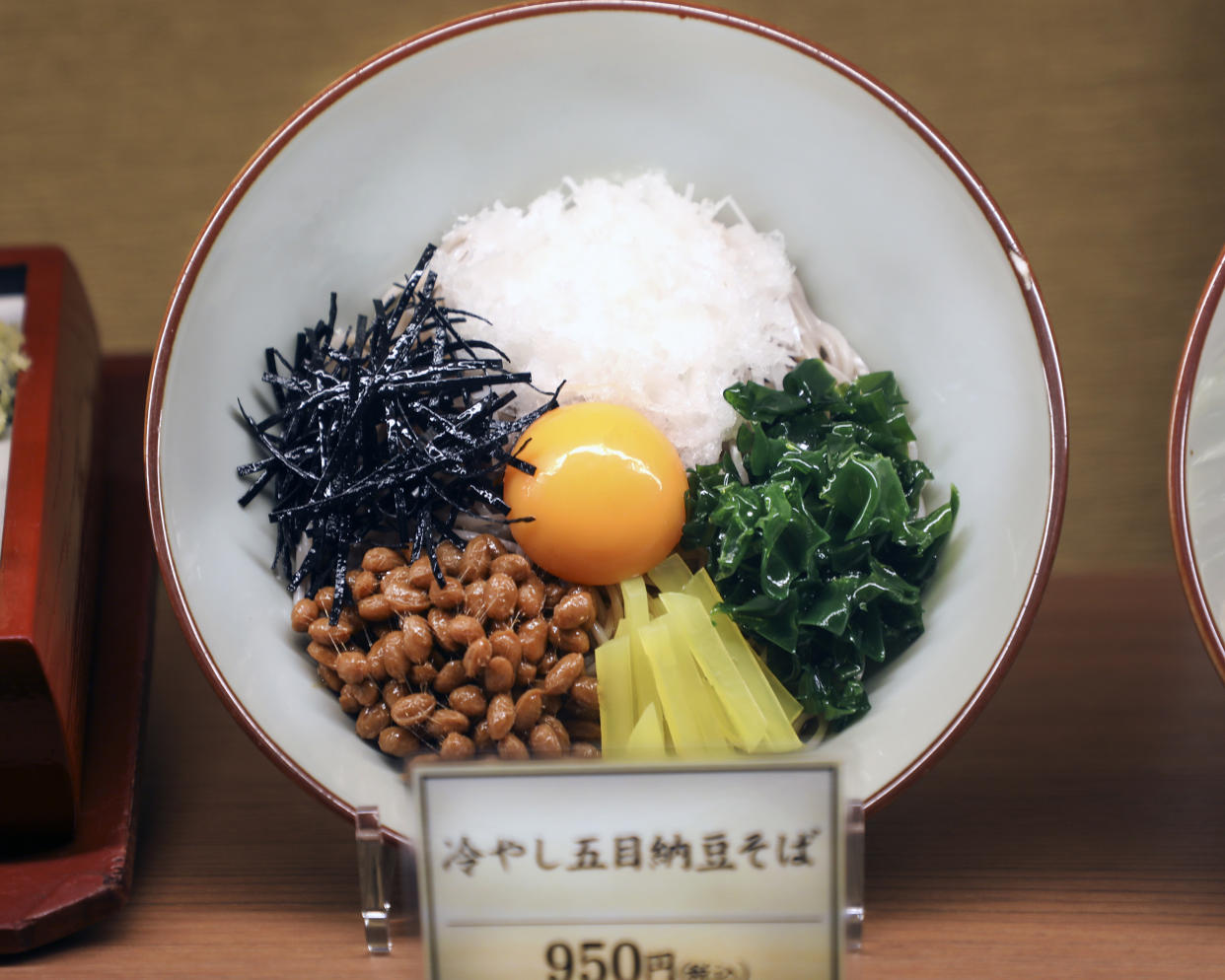 Chilled gomoku natto soba, buckwheat soba noodles with toppings, food model (DigiPub / Getty Images)