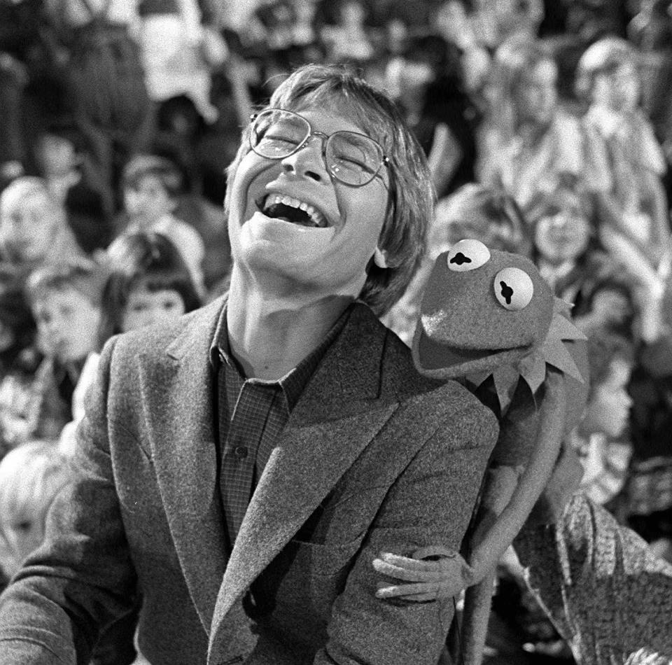 John Denver and Kermit the Frog laugh during the taping of a Muppet Christmas special in Los Angeles on Nov. 16, 1979.