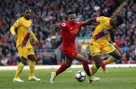 Britain Football Soccer - Liverpool v Crystal Palace - Premier League - Anfield - 23/4/17 Liverpool's Nathaniel Clyne in action with Crystal Palace's Wilfried Zaha Action Images via Reuters / Paul Childs Livepic