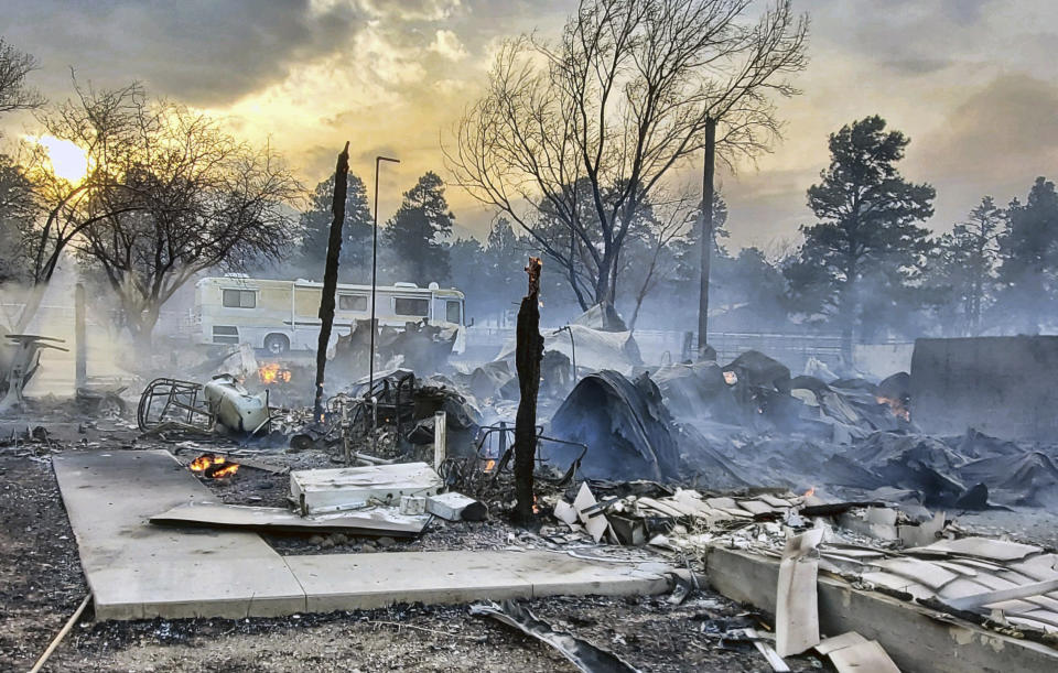 This Wednesday April 20, 2022, photo provided by Bill Wells shows his home on the outskirts of Flagstaff, Ariz., destroyed by a wildfire on Tuesday, April 19, 2022. The wind-whipped wildfire has forced the evacuation of hundreds of homes and animals. (Bill Wells via AP)