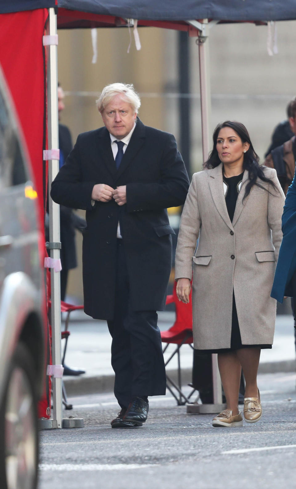 Prime Minister Boris Johnson (left) and Home Secretary, Priti Patel (right) attend London Bridge in central London after a terrorist wearing a fake suicide vest who went on a knife rampage killing two people, was shot dead by police.