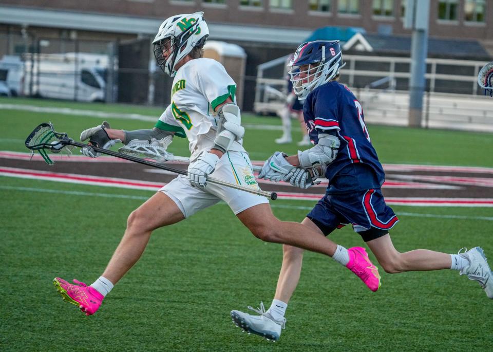 Lincolns Eli Hughes chases down Northman Judah Corriveau during Saturday's Division IV boys lacrosse championship.6-1-24