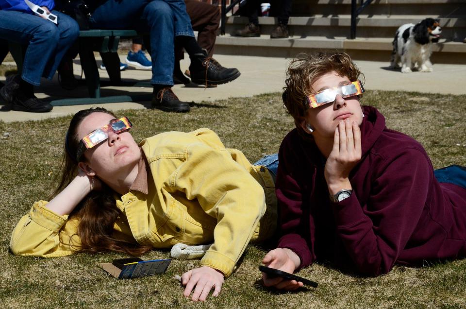 Marie and Louis Millard of Alanson watch the solar eclipse on Monday, April 8, 2024 at the Petoskey District Library.