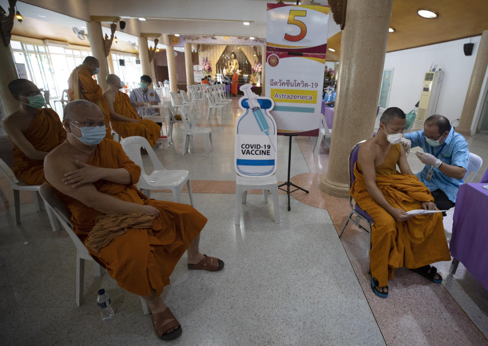 A health worker administers a dose of the AstraZeneca COVID-19 vaccine to a Buddhist monk at Nak Prok Temple in Bangkok, Thailand, Friday, April 9, 2021. (AP Photo/Sakchai Lalit) AstraZeneca