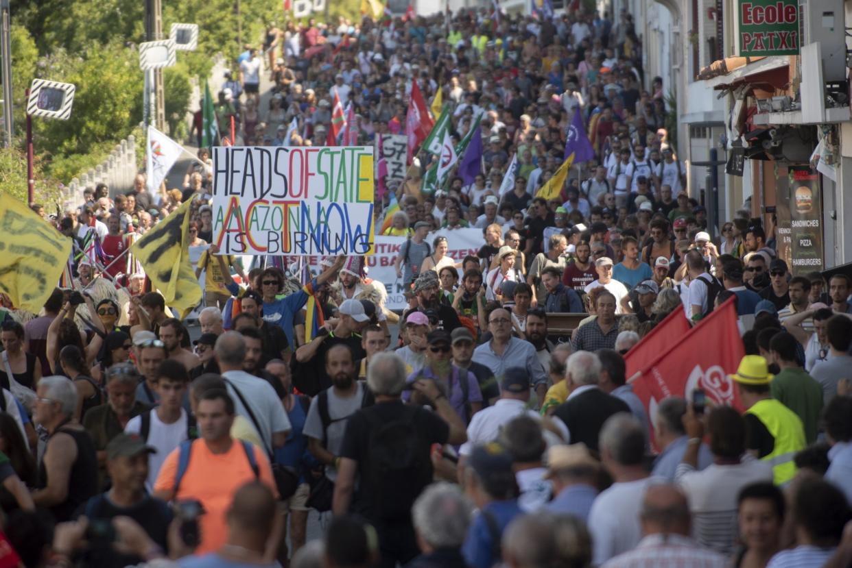 Protestors march during the annual G7 summit.