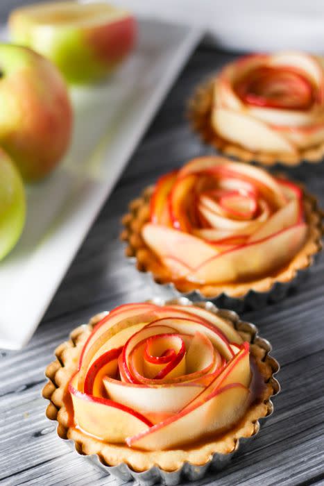 <p>The secret to crafting the rose shape of these beautiful little tarts is wrapping thin apple slices around each other until each crust is full. </p><p><strong>Get the recipe at <a href="http://www.platingsandpairings.com/salted-caramel-apple-tartlets/" rel="nofollow noopener" target="_blank" data-ylk="slk:Platings and Pairings;elm:context_link;itc:0;sec:content-canvas" class="link ">Platings and Pairings</a>.</strong></p>