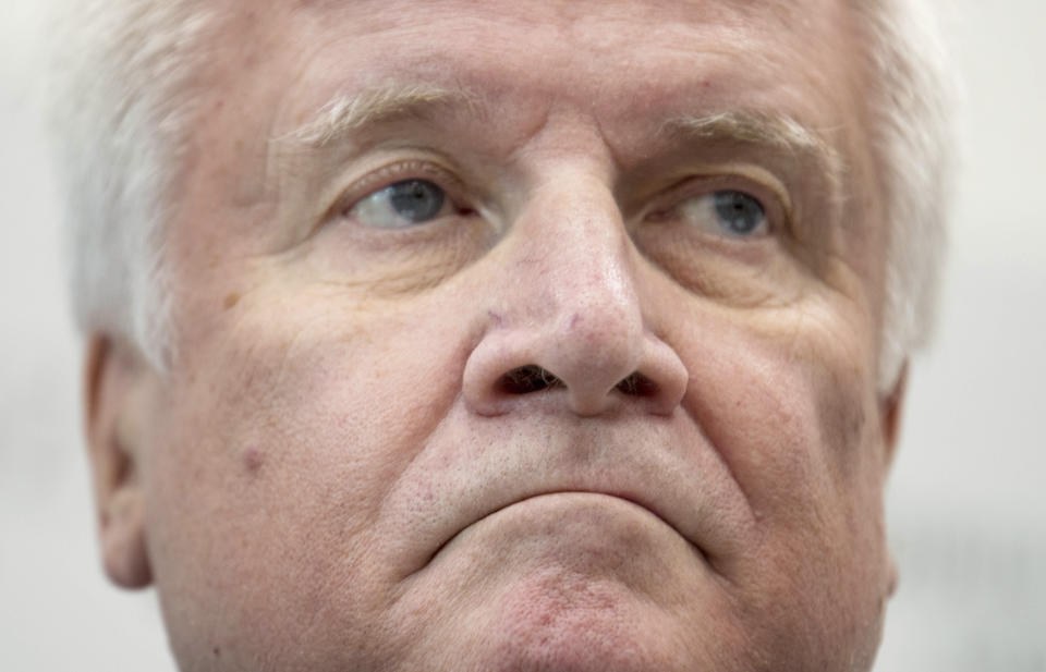 German interior minister Horst Seehofer looks on during his visit to a police station in Bautzen, eastern Germany, Monday, Nov. 12, 2018. (Monika Skolimowska/dpa via AP)