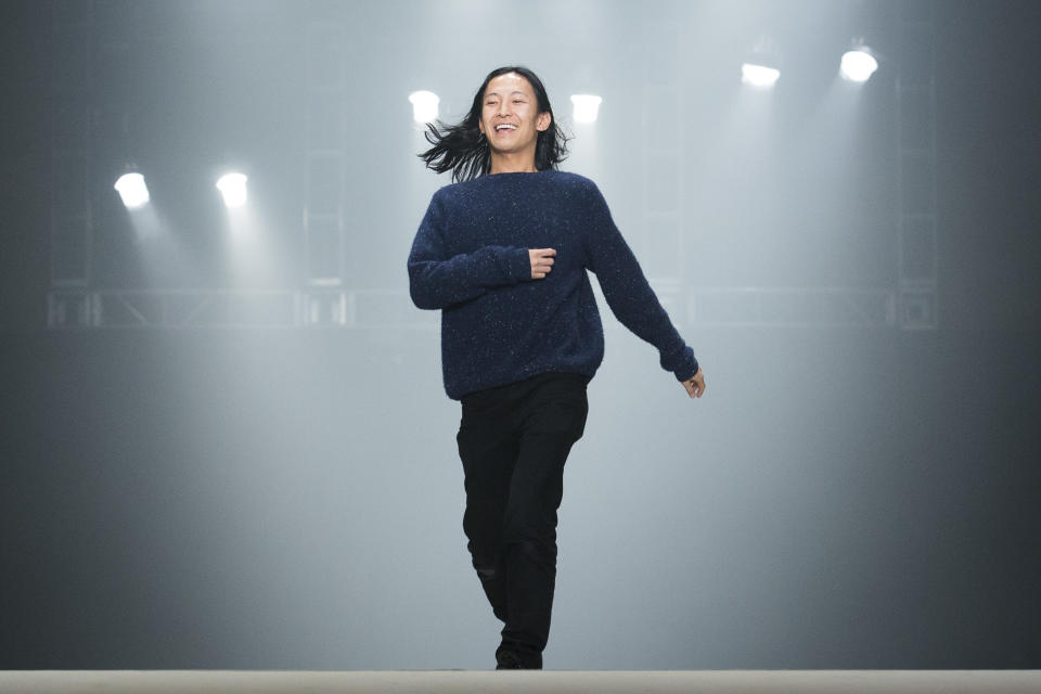 Designer Alexander Wang greets the audience following his Fall 2013 fashion show during Fashion Week, Saturday, Feb. 9, 2013, in New York. (AP Photo/John Minchillo)